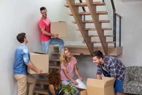 Moving boxes and furniture prepared for a Catford removal service