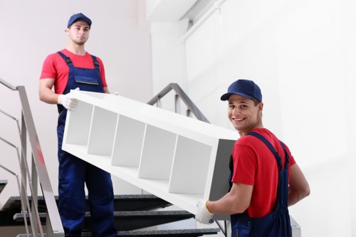 Removal team preparing a safe moving operation with boxes and equipment