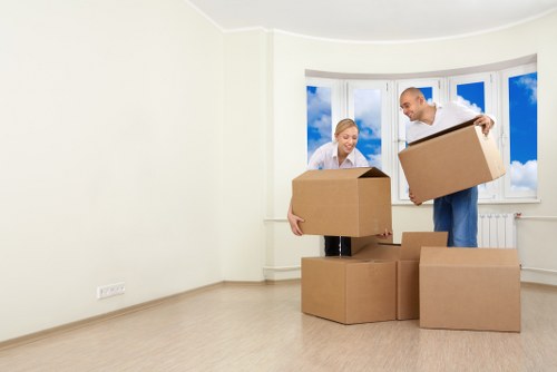 Removal team loading belongings into a moving van