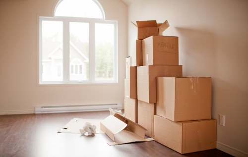 Trained movers handling furniture carefully in Catford