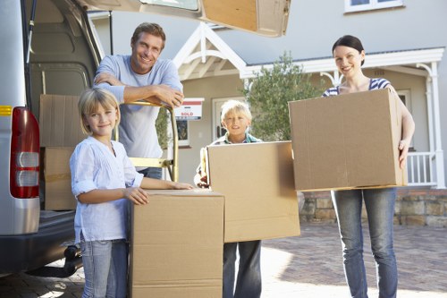 Moving team discussing a service issue during a removals review